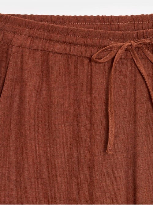 Pantaloni da donna in tessuto a gamba larga con vita con coulisse - Kiabi Pantaloni da donna in tessuto a gamba larga con vita con coulisse - Kiabi