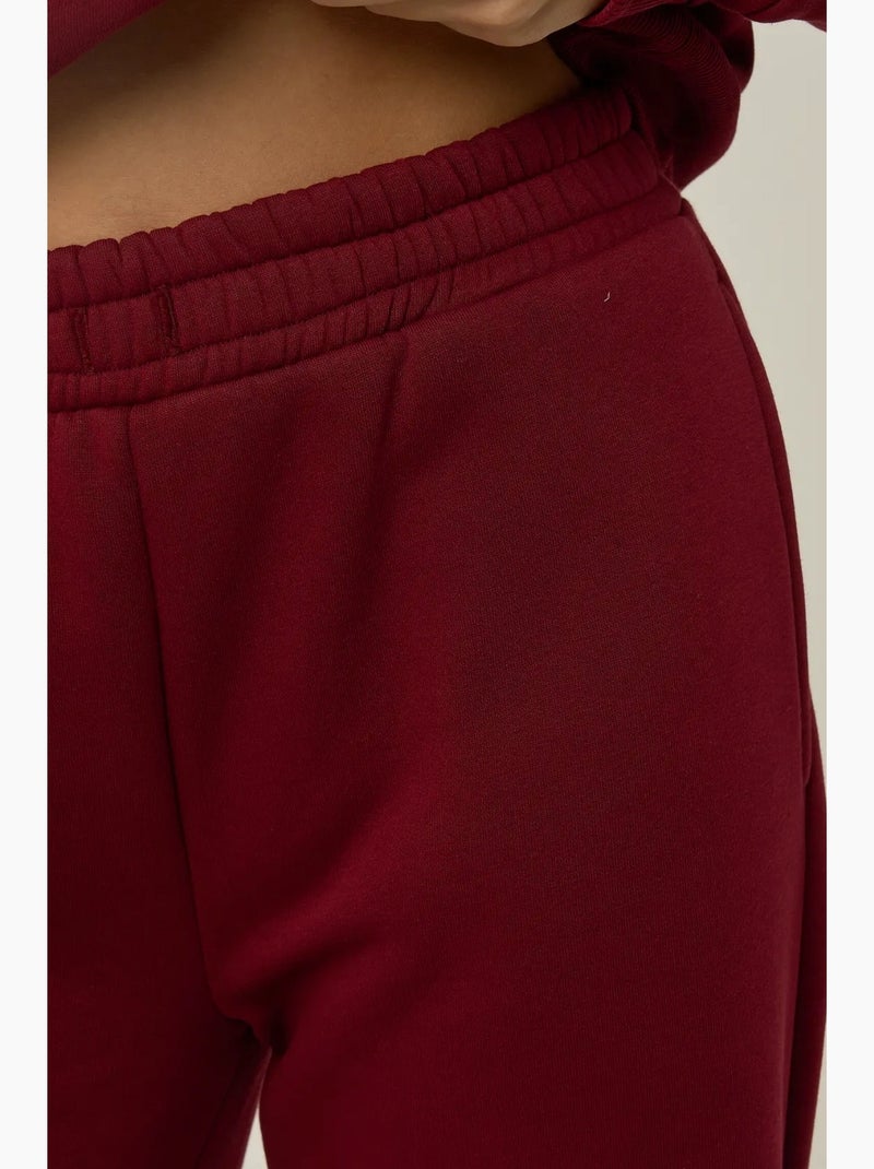Pantaloni da jogging a gamba larga con coulisse in vita hiccup Rosso bordeaux - Kiabi