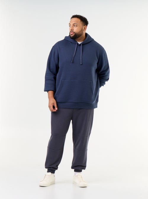 Pantaloni da jogging con fondo stretto e tasche con zip - Kiabi Pantaloni da jogging con fondo stretto e tasche con zip - Kiabi