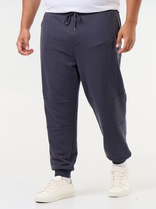 Pantaloni da jogging con fondo stretto e tasche con zip - Kiabi Pantaloni da jogging con fondo stretto e tasche con zip - Kiabi