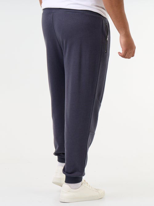 Pantaloni da jogging con fondo stretto e tasche con zip - Kiabi Pantaloni da jogging con fondo stretto e tasche con zip - Kiabi