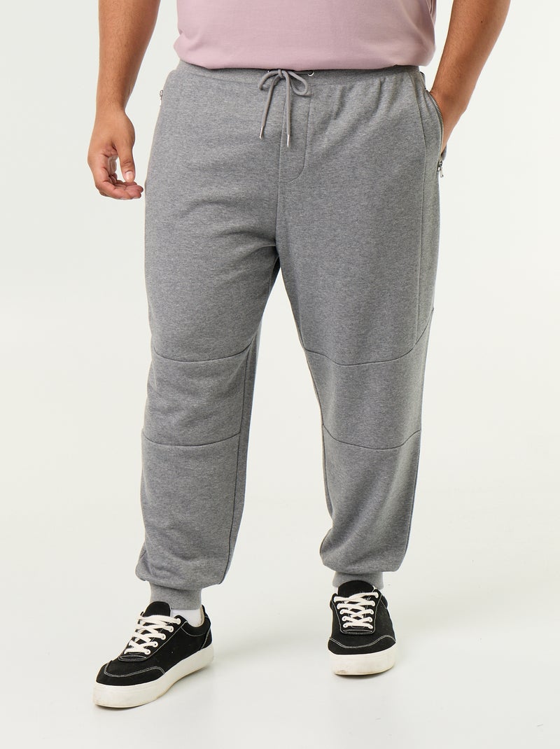 Pantaloni da jogging con fondo stretto e tasche con zip Grigio - Kiabi