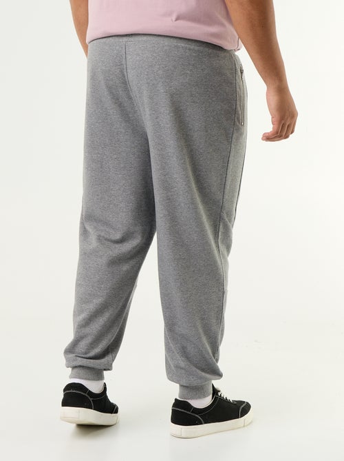 Pantaloni da jogging con fondo stretto e tasche con zip - Kiabi Pantaloni da jogging con fondo stretto e tasche con zip - Kiabi