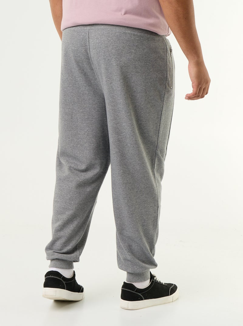 Pantaloni da jogging con fondo stretto e tasche con zip Grigio - Kiabi