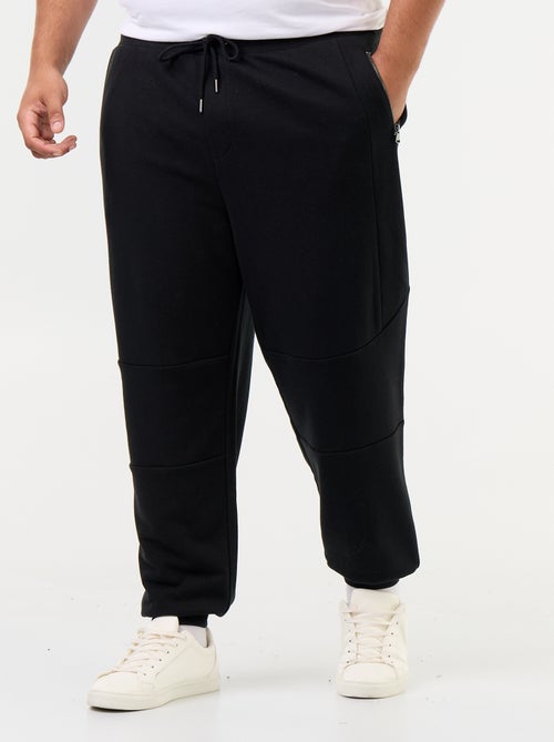 Pantaloni da jogging con fondo stretto e tasche con zip - Kiabi Pantaloni da jogging con fondo stretto e tasche con zip - Kiabi