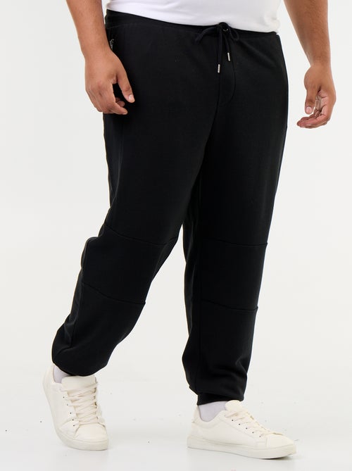 Pantaloni da jogging con fondo stretto e tasche con zip - Kiabi Pantaloni da jogging con fondo stretto e tasche con zip - Kiabi