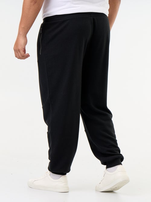 Pantaloni da jogging con fondo stretto e tasche con zip - Kiabi Pantaloni da jogging con fondo stretto e tasche con zip - Kiabi