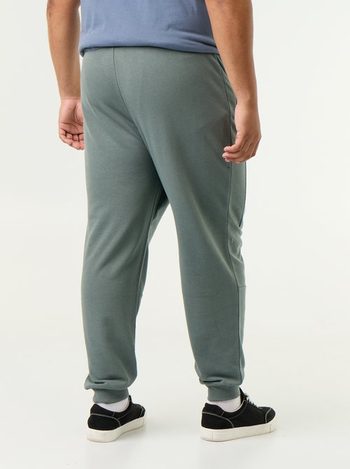 Pantaloni da jogging con fondo stretto e tasche con zip - Kiabi
