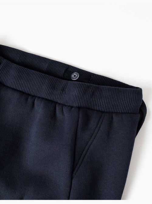 Pantaloni da jogging spazzolati con tasche cargo e stampa - Kiabi Pantaloni da jogging spazzolati con tasche cargo e stampa - Kiabi