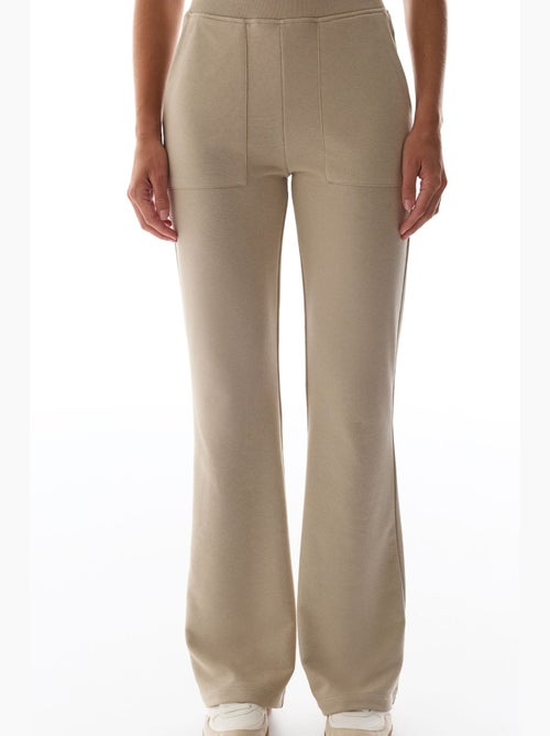 Pantaloni da tuta a zampa con dettaglio ribana penti - Kiabi Pantaloni da tuta a zampa con dettaglio ribana penti - Kiabi