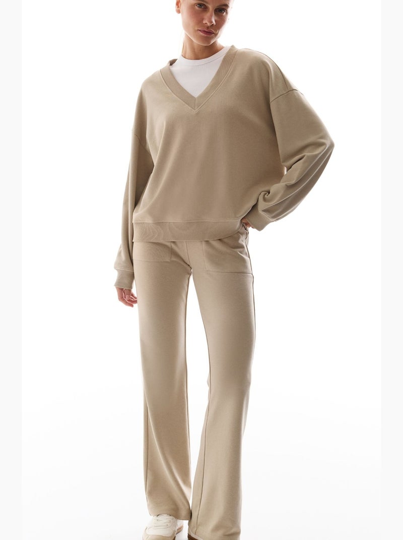 Pantaloni da tuta a zampa con dettaglio ribana penti Beige argilla - Kiabi