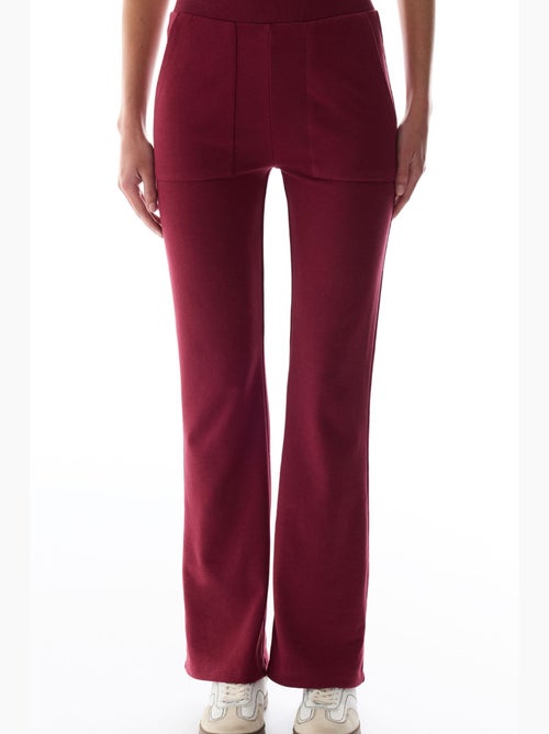 Pantaloni da tuta a zampa con dettaglio ribana penti - Kiabi Pantaloni da tuta a zampa con dettaglio ribana penti - Kiabi