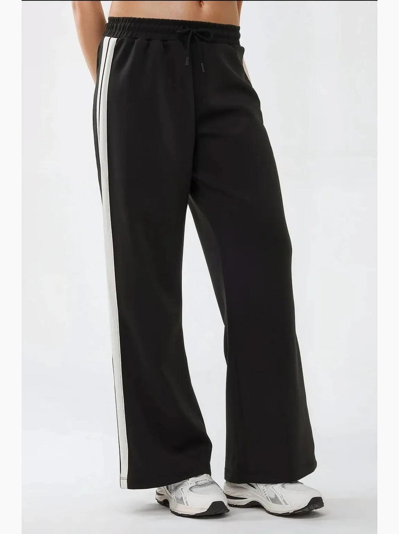 Pantaloni della tuta a righe a gamba ampia hiccup Nero - Kiabi