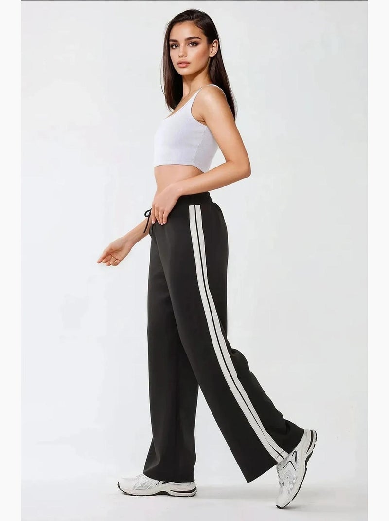 Pantaloni della tuta a righe a gamba ampia hiccup Nero - Kiabi