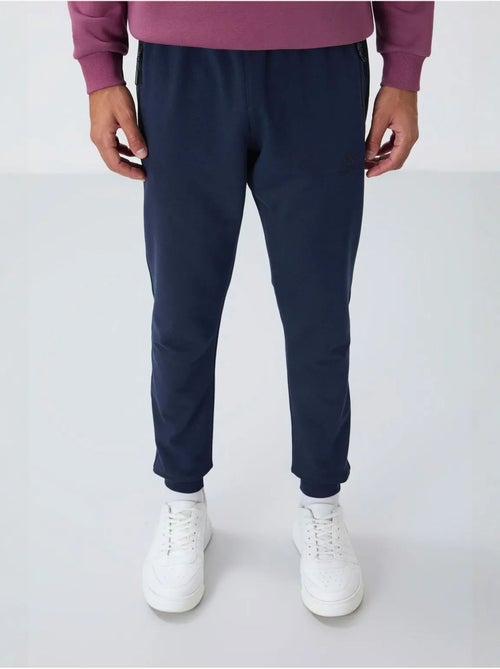 Pantaloni della tuta jogger da uomo con tasca con zip tommy - Kiabi Pantaloni della tuta jogger da uomo con tasca con zip tommy - Kiabi