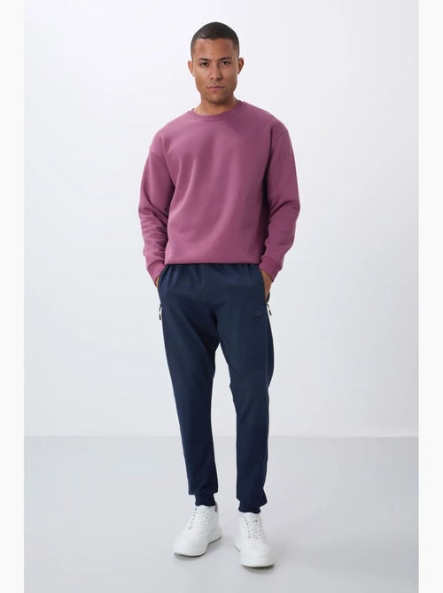 Pantaloni della tuta jogger da uomo con tasca con zip tommy - Kiabi Pantaloni della tuta jogger da uomo con tasca con zip tommy - Kiabi