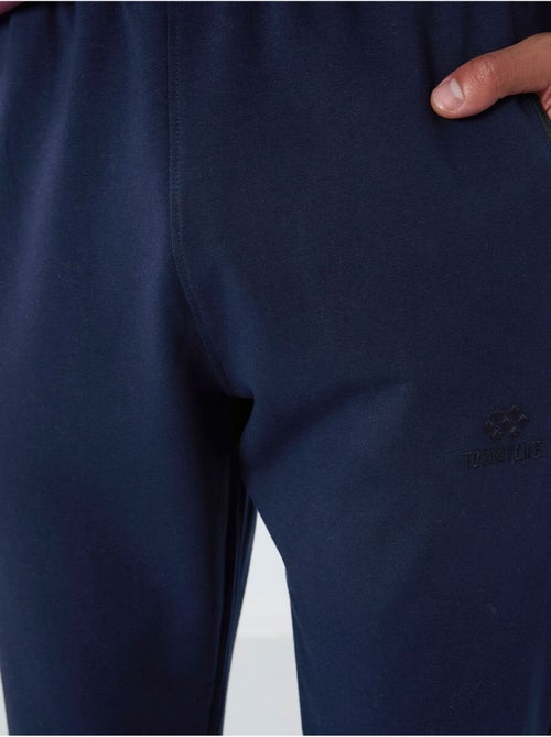 Pantaloni della tuta jogger da uomo con tasca con zip tommy - Kiabi Pantaloni della tuta jogger da uomo con tasca con zip tommy - Kiabi