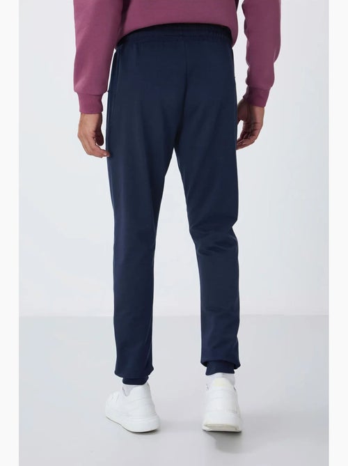 Pantaloni della tuta jogger da uomo con tasca con zip tommy - Kiabi Pantaloni della tuta jogger da uomo con tasca con zip tommy - Kiabi