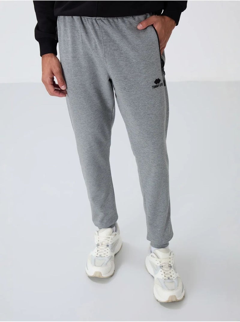 Pantaloni della tuta jogger da uomo con tasca con zip tommy Grigio - Kiabi