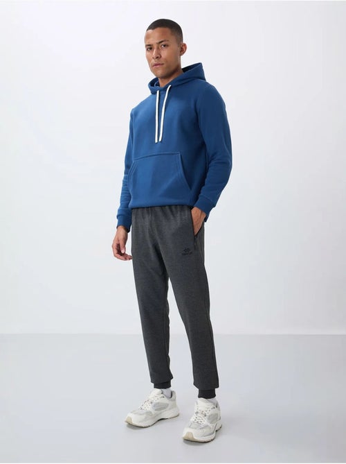 Pantaloni della tuta jogger da uomo con tasca con zip tommy - Kiabi Pantaloni della tuta jogger da uomo con tasca con zip tommy - Kiabi