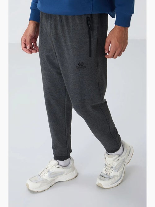 Pantaloni della tuta jogger da uomo con tasca con zip tommy - Kiabi Pantaloni della tuta jogger da uomo con tasca con zip tommy - Kiabi