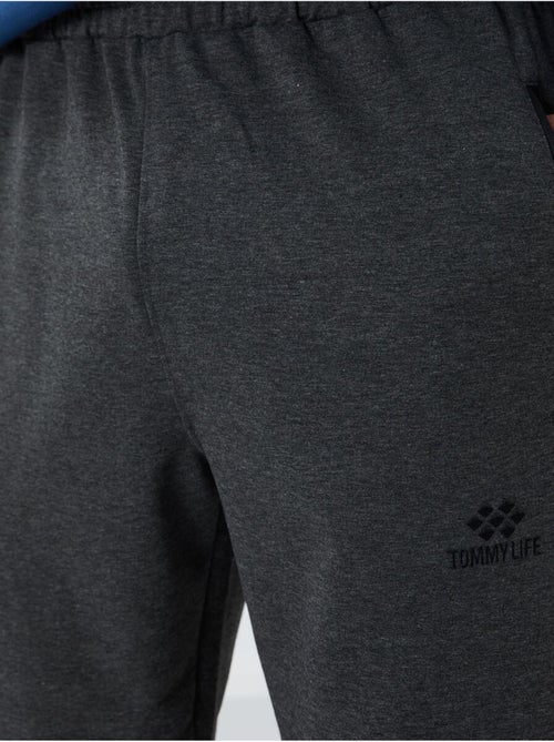 Pantaloni della tuta jogger da uomo con tasca con zip tommy - Kiabi Pantaloni della tuta jogger da uomo con tasca con zip tommy - Kiabi