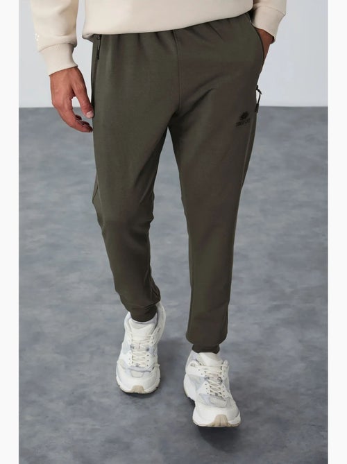 Pantaloni della tuta jogger da uomo con tasca con zip tommy - Kiabi Pantaloni della tuta jogger da uomo con tasca con zip tommy - Kiabi