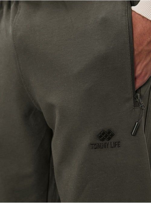 Pantaloni della tuta jogger da uomo con tasca con zip tommy - Kiabi Pantaloni della tuta jogger da uomo con tasca con zip tommy - Kiabi