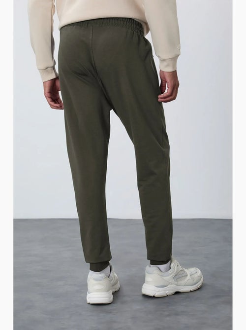 Pantaloni della tuta jogger da uomo con tasca con zip tommy - Kiabi Pantaloni della tuta jogger da uomo con tasca con zip tommy - Kiabi