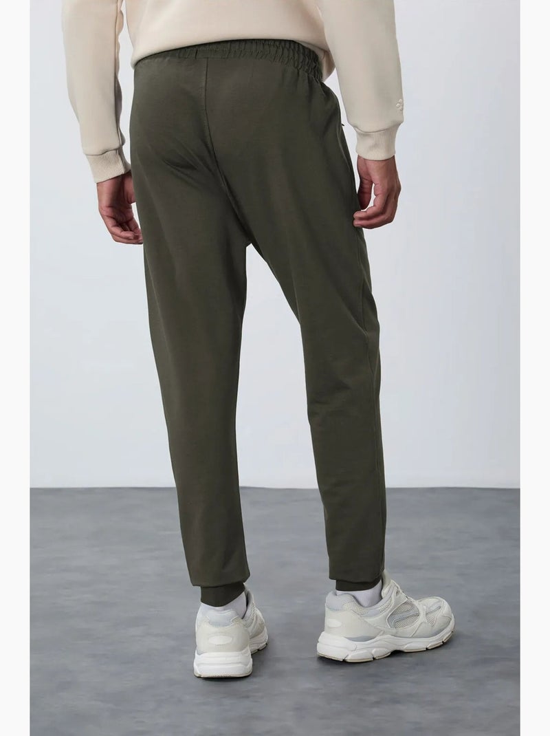 Pantaloni della tuta jogger da uomo con tasca con zip tommy Verde kaki - Kiabi