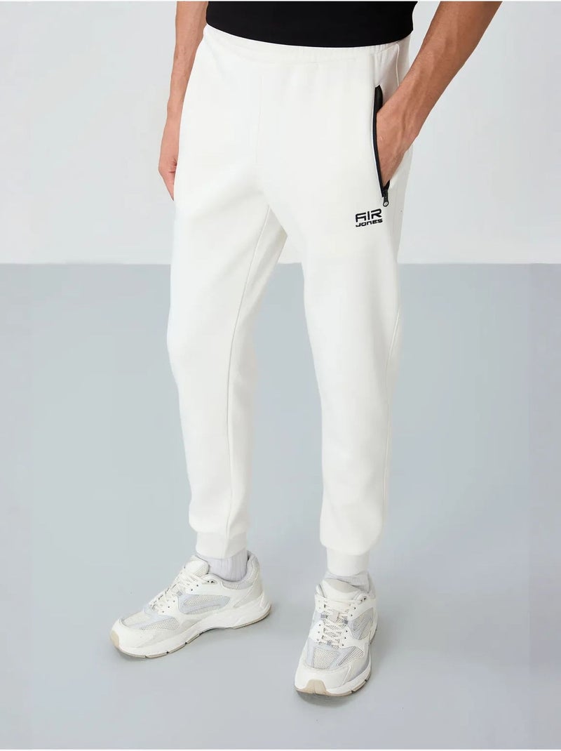 Pantaloni della tuta jogger da uomo tommy Bianco sporco - Kiabi