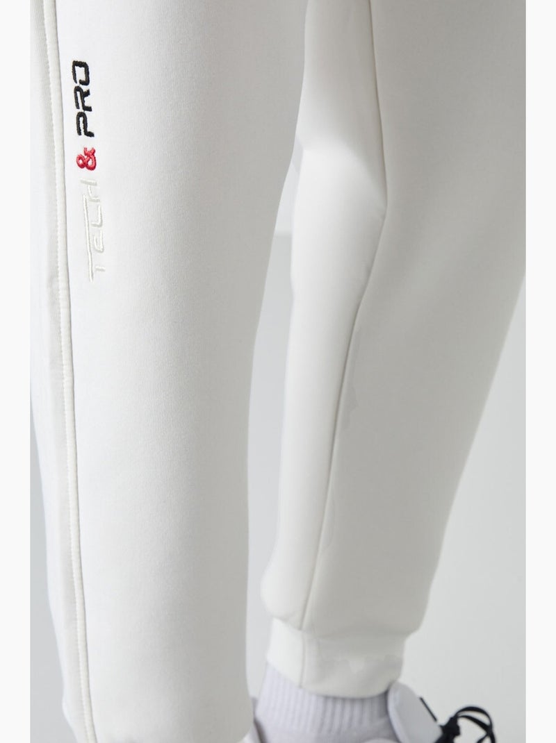 Pantaloni della tuta jogger slim da uomo tommy Bianco sporco - Kiabi
