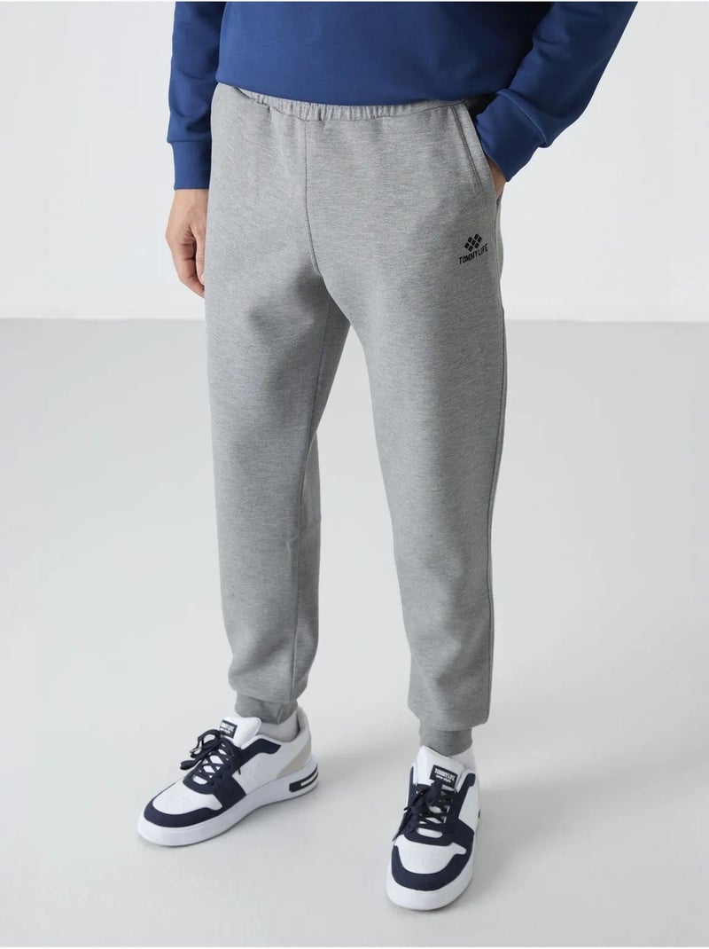 Pantaloni della tuta jogger slim da uomo tommy Grigio chiaro - Kiabi