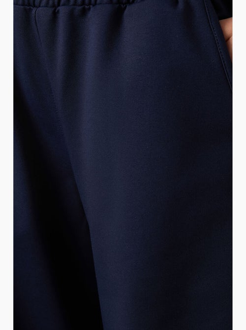 Pantaloni della tuta pull-on a gamba ampia tommy - Kiabi Pantaloni della tuta pull-on a gamba ampia tommy - Kiabi