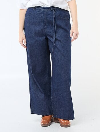 Pantaloni denim / jeans a vita bassa e taglio ampio