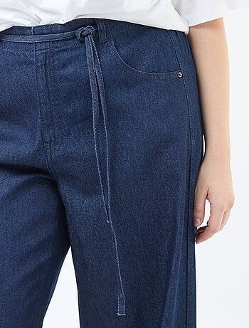 Pantaloni denim / jeans a vita bassa e taglio ampio