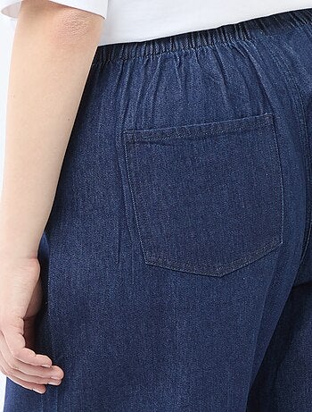 Pantaloni denim / jeans a vita bassa e taglio ampio