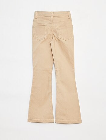 Pantaloni flare - Taglio + aderente