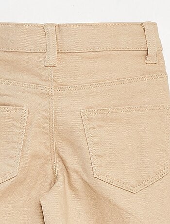 Pantaloni flare - Taglio + aderente