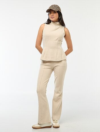Pantaloni flare in maglia tinta unita