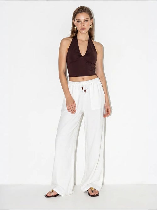 Pantaloni in cotone a gamba ampia con vita con coulisse lucci - Kiabi Pantaloni in cotone a gamba ampia con vita con coulisse lucci - Kiabi