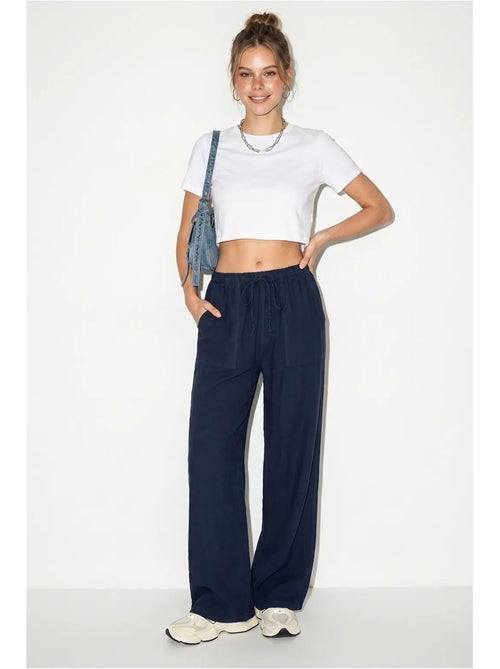 Pantaloni in cotone a gamba ampia con vita con coulisse lucci - Kiabi Pantaloni in cotone a gamba ampia con vita con coulisse lucci - Kiabi