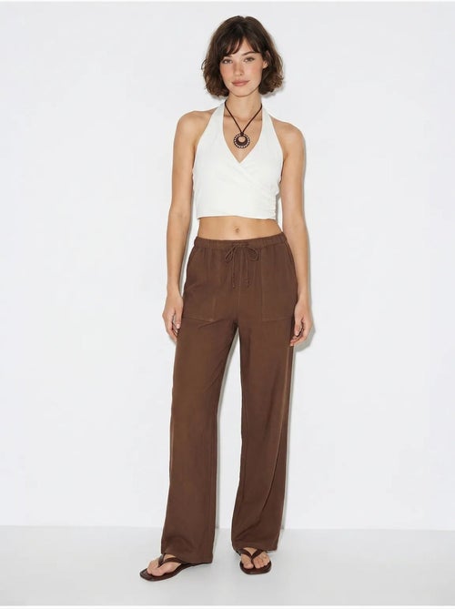 Pantaloni in cotone a gamba ampia con vita con coulisse lucci - Kiabi Pantaloni in cotone a gamba ampia con vita con coulisse lucci - Kiabi