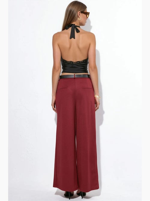 Pantaloni in crêpe a gamba ampia a vita alta con cintura busem - Kiabi Pantaloni in crêpe a gamba ampia a vita alta con cintura busem - Kiabi