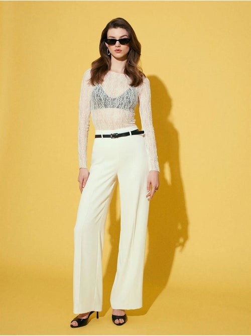 Pantaloni in crêpe a gamba ampia con cintura - Kiabi Pantaloni in crêpe a gamba ampia con cintura - Kiabi