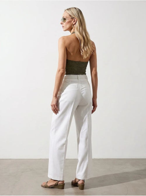 Pantaloni in crêpe a gamba ampia con cintura dilvin - Kiabi Pantaloni in crêpe a gamba ampia con cintura dilvin - Kiabi
