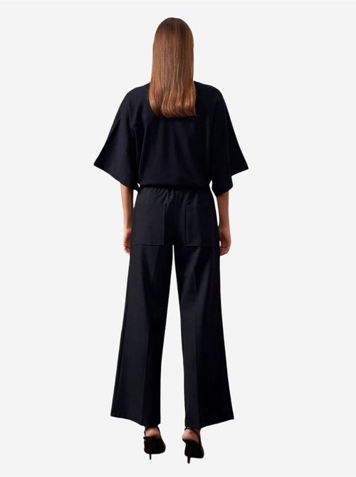 Pantaloni in crêpe a gamba ampia con cintura dilvin - Kiabi Pantaloni in crêpe a gamba ampia con cintura dilvin - Kiabi