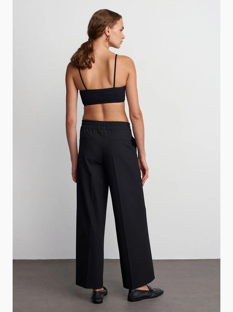 Pantaloni in crêpe a gamba ampia con vita con coulisse dilvin Nero - Kiabi