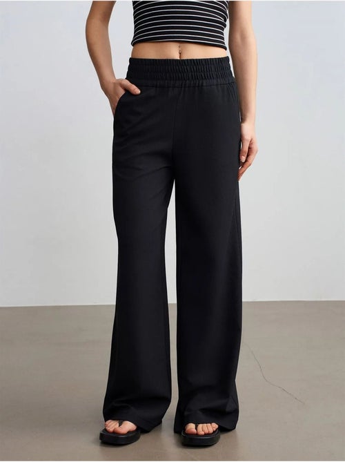 Pantaloni in crêpe a gamba ampia da donna - Kiabi Pantaloni in crêpe a gamba ampia da donna - Kiabi
