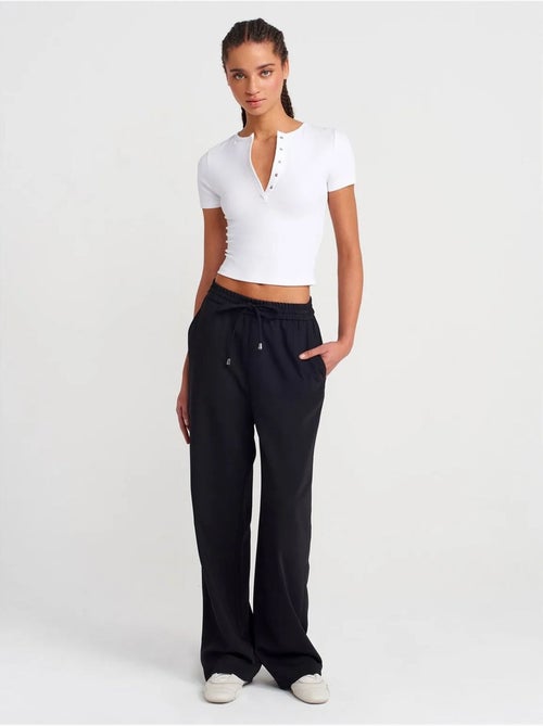 Pantaloni in crêpe a gamba ampia - Kiabi Pantaloni in crêpe a gamba ampia - Kiabi